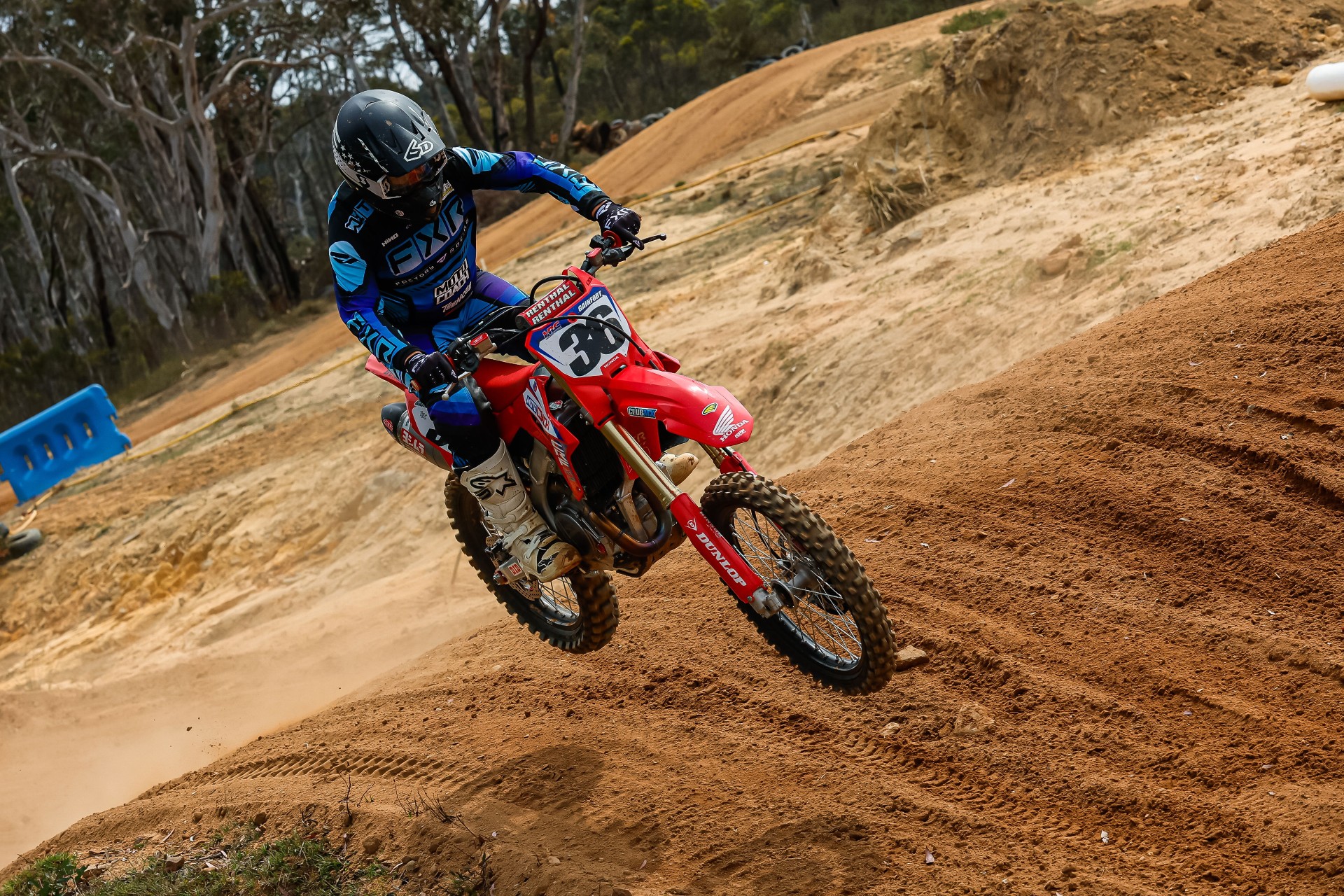 Sydney motocross student accelerating out of berm with Moto Coach